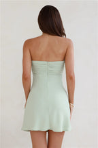 A sweet and spicy strapless mini dress – a must-have for a flirty and alluring look