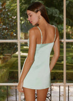Sage green strapless mini dress with bead embellishments