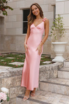 Parties In Spring: A soft pink satin maxi dress – a show-stopping outfit for parties.